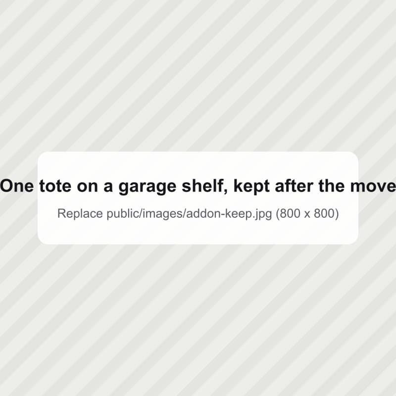 A single tote on a garage shelf after the move