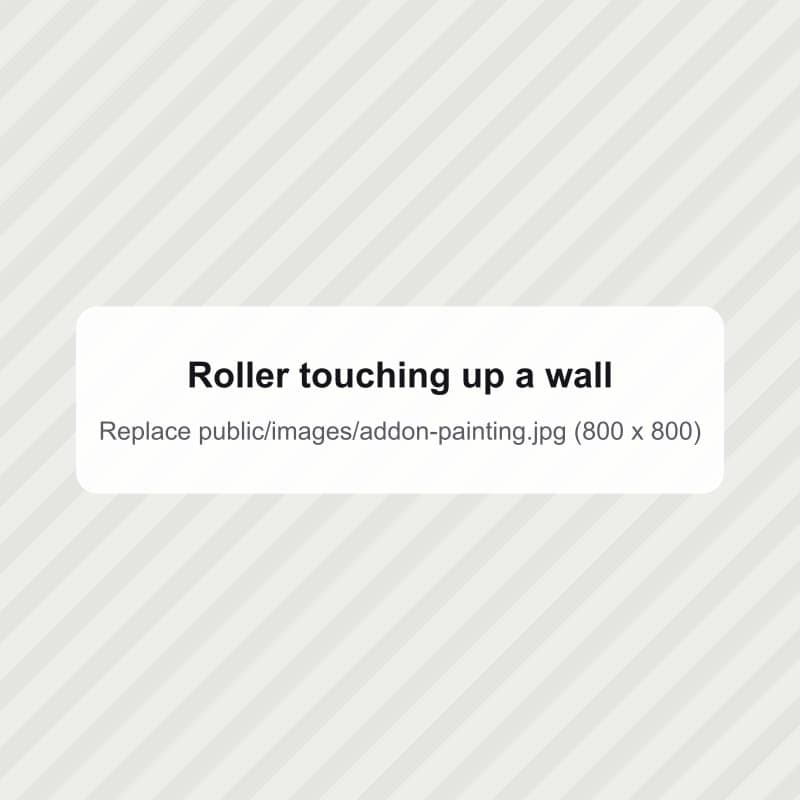A paint roller touching up a wall
