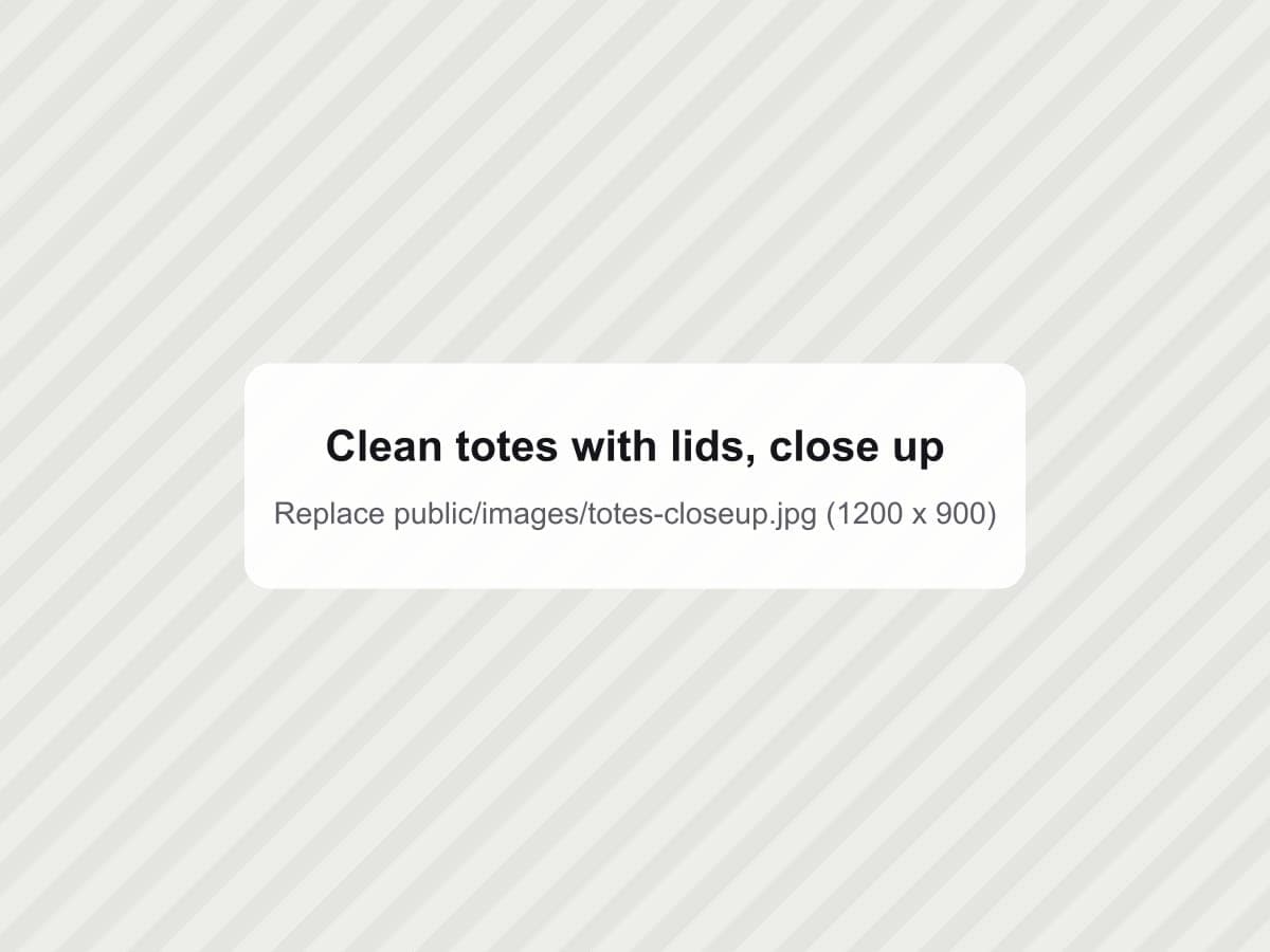 Close-up of clean black totes with red and yellow lids
